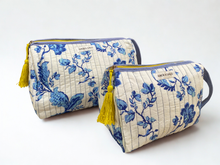 Load image into Gallery viewer, wo fabric pouches with blue floral patterns and yellow tassels on a white background