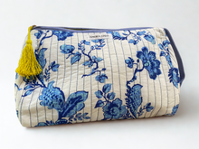 Load image into Gallery viewer, Floral-patterned pouch with a yellow tassel on a white background