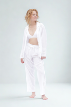 Load image into Gallery viewer, Woman wearing a white lon on a plain background sleeve pyjama set