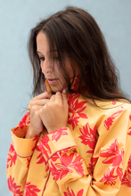 Load image into Gallery viewer, Woman wearing a yellow pyjama with  floral print 
