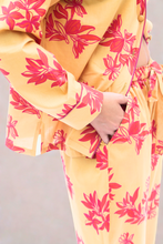 Load image into Gallery viewer, Yellow pyjama with pink floral patterns on a plain background
