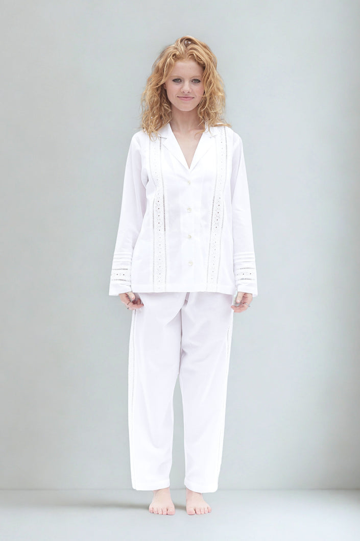 Woman wearing a white long sleeve pyjama set 