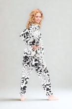 Load image into Gallery viewer, Woman wearing a black and white floral patterned pyjama on a plain background
