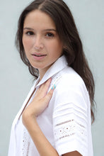 Load image into Gallery viewer, Woman wearing a whitepyjama set against a light gray background
